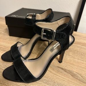 Black ankle strap heels, size 8.